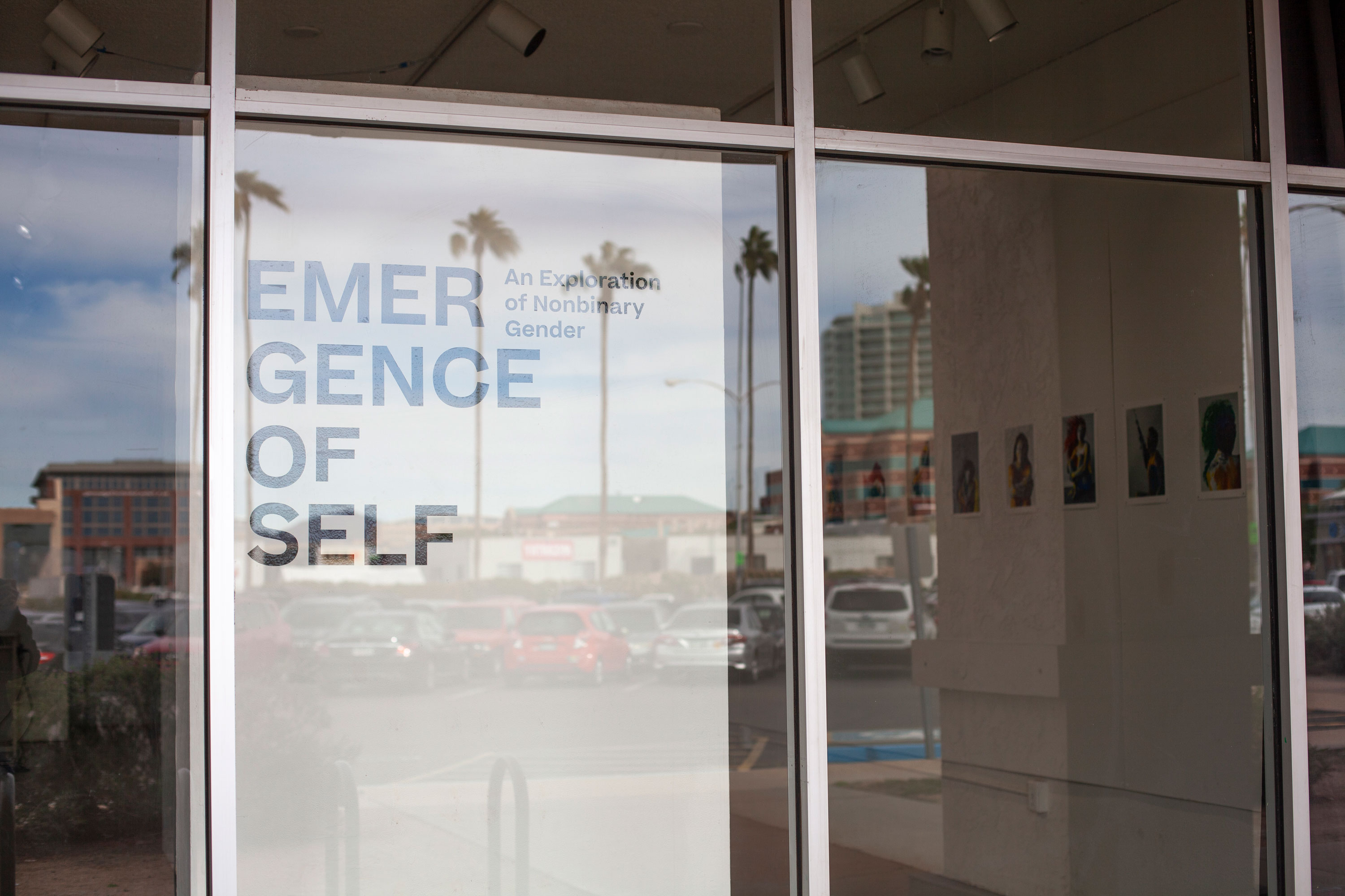 photograph of exhibition pylon with the title "emergence of self"